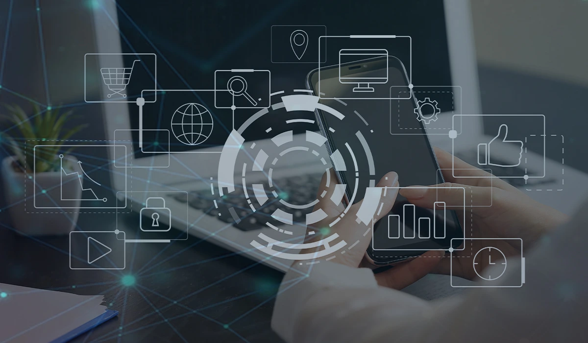 A visual representation of 16 effective digital marketing tactics and strategies for 2025 and beyond. A person uses a smartphone in front of a laptop, overlaid with digital icons like a globe, chart, and thumbs-up, symbolizing technology and connectivity.